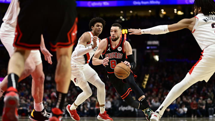 Mar 24, 2023; Portland, Oregon, USA; Chicago Bulls guard Zach LaVine (8) drives to the basket during the first half against Portland Trail Blazers guard Matisse Thybulle (4) at Moda Center. Mandatory Credit: Troy Wayrynen-Imagn Images