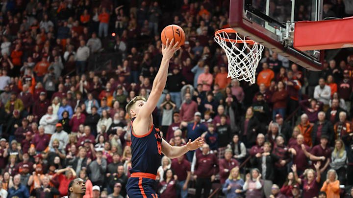 Dec 31, 2025; Blacksburg, Virginia, USA;  Virginia Cavaliers forward Thijs de Ridder (28) lays the ball up against the Virginia Tech Hokies in the second overtime period at Cassell Coliseum. Mandatory Credit: Brian Bishop-Imagn Images.