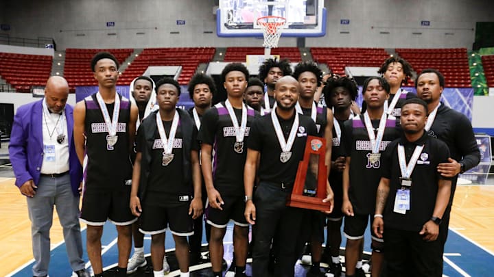 Crossroad Academy team and coach Colin Anderson with the runner up trophy. Hawthorne HS defeated Crossroad Academy 59-38 in the FHSAA Rural State Boys basketball Championship game at the RP Funding Center in Lakeland Fl. February 28th 2025. Photos special to the Ledger / Calvin Knight