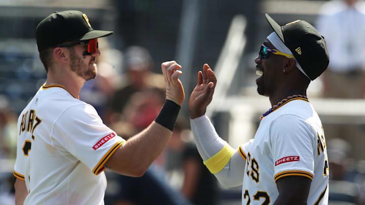 Jun 22, 2025; Pittsburgh, Pennsylvania, USA;  Pittsburgh Pirates first baseman Spencer Horwitz (2) and designated hitter Andrew McCutchen (22) celebrate after defeating the Texas Rangers at PNC Park. Mandatory Credit: Charles LeClaire-Imagn Images