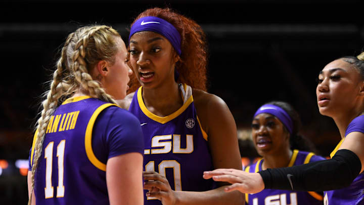 LSU's Angel Reese (10) and teammates calm Hailey Van Lith (11) after a foul was called against Lith during an NCAA college basketball game on Sunday, February 25, 2024 in Knoxville, Tenn.