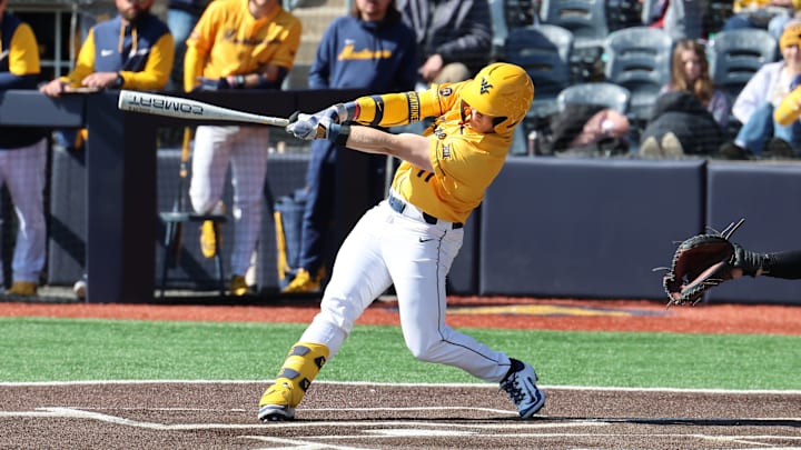 West Virginia University infielder Sam White lifts a three-run home run in the bottom of the first inning against Kennesaw State.