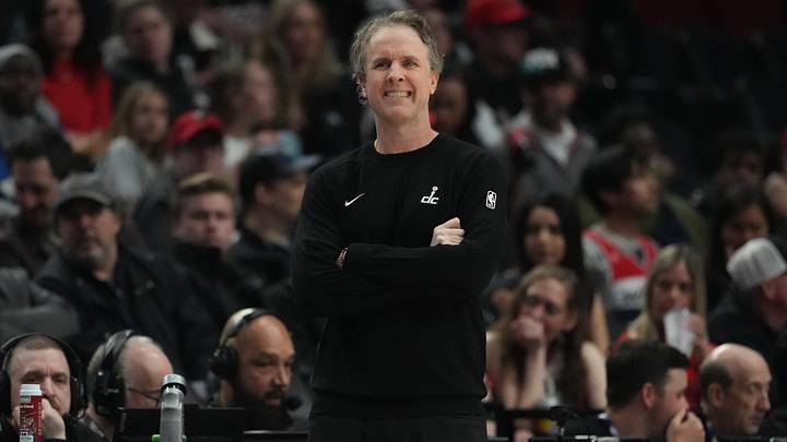 Mar 29, 2026; Portland, Oregon, USA; Washington Wizards head coach Brian Keefe watches from the sideline during the first half against the Portland Trail Blazers at Moda Center. Mandatory Credit: Soobum Im-Imagn Images