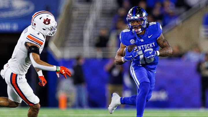 Oct 26, 2024; Lexington, Kentucky, USA; Kentucky Wildcats running back Jamarion Wilcox (10) runs the ball during the first quarter against the Auburn Tigers at Kroger Field. Mandatory Credit: Jordan Prather-Imagn Images