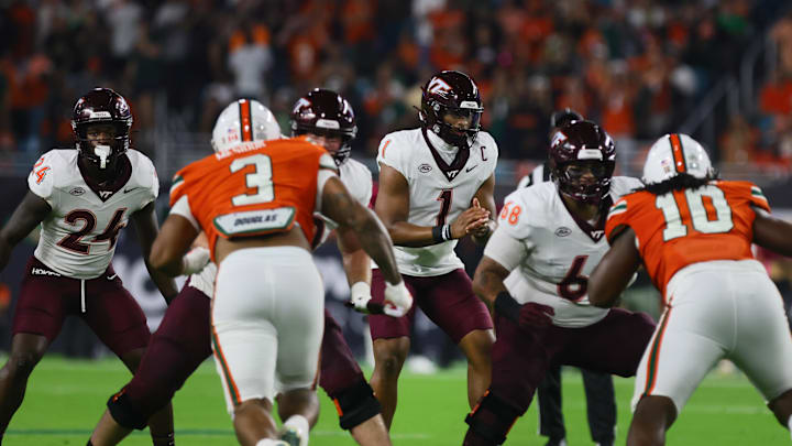 Sep 27, 2024; Miami Gardens, Florida, USA; Virginia Tech Hokies quarterback Kyron Drones (1) calls for the snap against the Miami Hurricanes during the first quarter at Hard Rock Stadium. Mandatory Credit: Sam Navarro-Imagn Images
