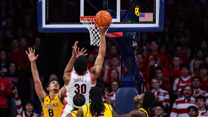 Mar 4, 2025; Tucson, Arizona, USA; Arizona Wildcats forward Tobe Awaka (30) goes for a basket against Arizona State Sun Devils forward Basheer Jihad (8) during the first half at McKale Center. Mandatory Credit: Aryanna Frank-Imagn Images