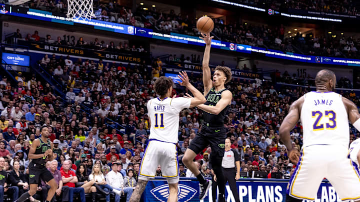 Apr 14, 2024; New Orleans, Louisiana, USA; New Orleans Pelicans guard Dyson Daniels (11) shoots a jump shot against Los Angeles Lakers center Jaxson Hayes (11) during the first half at Smoothie King Center. Mandatory Credit: Stephen Lew-Imagn Images Apr 14, 2024; New Orleans, Louisiana, USA; New Orleans Pelicans guard Dyson Daniels (11) shoots a jump shot against Los Angeles Lakers center Jaxson Hayes (11) during the first half at Smoothie King Center. Mandatory Credit: Stephen Lew-Imagn Images