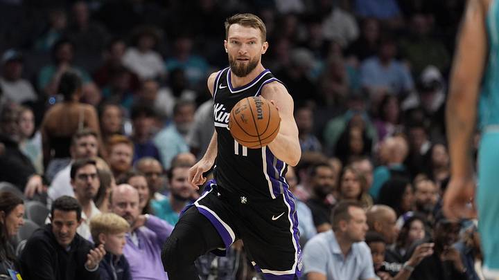 Sacramento Kings forward Domantas Sabonis (11) handles the ball against the Charlotte Hornets Sacramento Kings forward Domantas Sabonis (11) handles the ball against the Charlotte Hornets