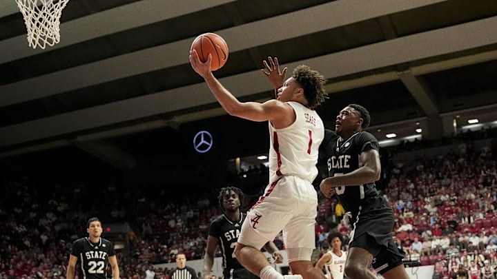 Feb 25, 2025; Tuscaloosa, AL, USA;  Alabama guard Mark Sears (1) slips past Mississippi State guard Shawn Jones Jr. (5) as he goes to the basket at Coleman Coliseum. Mandatory Credit: Gary Cosby Jr.-Tuscaloosa News