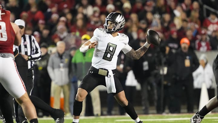 Nov 16, 2024; Madison, Wisconsin, USA;  Oregon Ducks quarterback Dillon Gabriel (8) throws a pass during the first quarter against the Wisconsin Badgers at Camp Randall Stadium. Mandatory Credit: Jeff Hanisch-Imagn Images