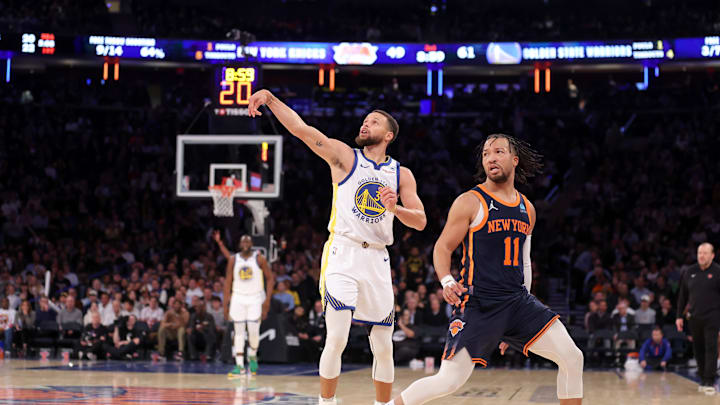 Feb 29, 2024; New York, New York, USA; Golden State Warriors guard Stephen Curry (30) watches his three point shot against New York Knicks guard Jalen Brunson (11) during the third quarter at Madison Square Garden. Mandatory Credit: Brad Penner-Imagn Images