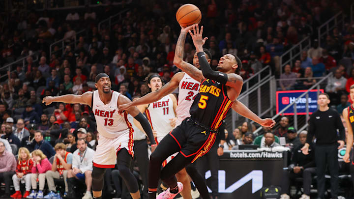 Apr 9, 2024; Atlanta, Georgia, USA; Atlanta Hawks guard Dejounte Murray (5) shoots against the Miami