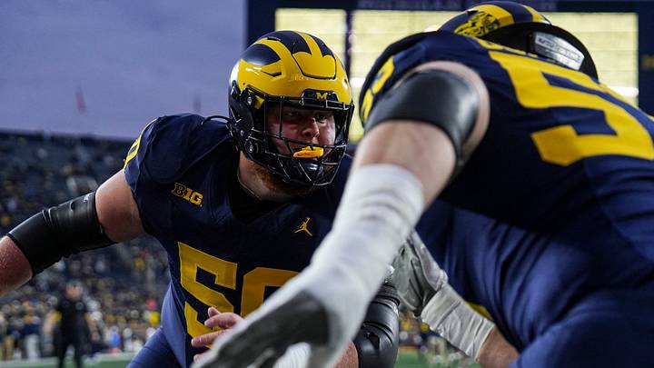 Michigan offensive lineman Luke Hamilton (50) warms up with offensive lineman Jake Guarnera (53) ahead of the Purdue game at Michigan Stadium in Ann Arbor on Saturday, November 1, 2025.