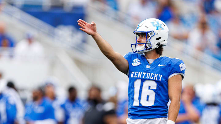 Sep 21, 2024; Lexington, Kentucky, USA; Kentucky Wildcats place kicker Alex Raynor (16) lines up an extra point attempt during the second quarter against the Ohio Bobcats at Kroger Field. Mandatory Credit: Jordan Prather-Imagn Images