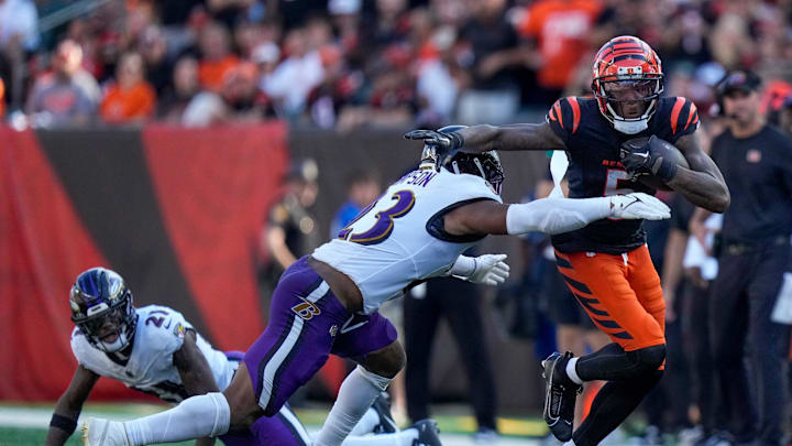 Cincinnati Bengals wide receiver Tee Higgins (5) breaks tackles on a reception in the fourth quarter of the NFL Week 5 game between the Cincinnati Bengals and Baltimore Ravens at Paycor Stadium in downtown Cincinnati on Sunday, Oct. 6, 2024. The Bengals fell to 1-4 on the season with a 41-38 loss to the Ravens. Cincinnati Bengals wide receiver Tee Higgins (5) breaks tackles on a reception in the fourth quarter of the NFL Week 5 game between the Cincinnati Bengals and Baltimore Ravens at Paycor Stadium in downtown Cincinnati on Sunday, Oct. 6, 2024. The Bengals fell to 1-4 on the season with a 41-38 loss to the Ravens.