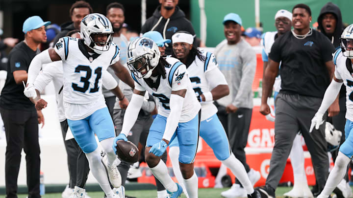 Oct 19, 2025; East Rutherford, New Jersey, USA; Carolina Panthers cornerback Jaycee Horn (8) celebrates an interception intended for New York Jets wide receiver Josh Reynolds (83) in the fourth quarter at MetLife Stadium. Mandatory Credit: Vincent Carchietta-Imagn Images