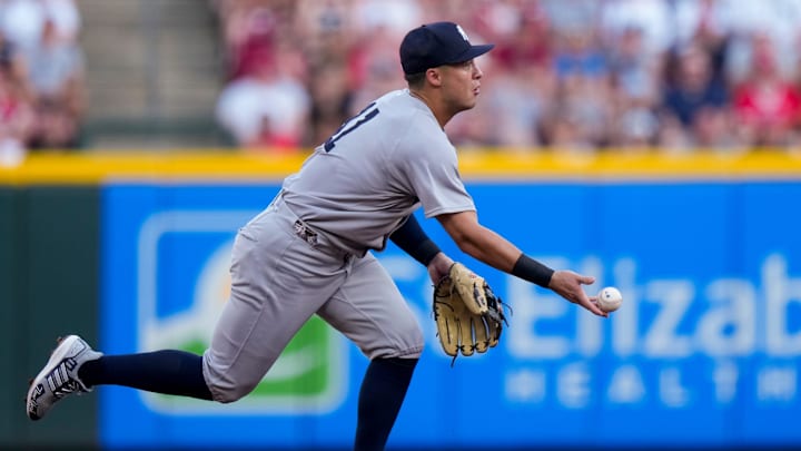 New York Yankees shortstop Anthony Volpe (11) plays a ground ball off the bat of Cincinnati Reds designated hitter Tyler Stephenson (37) in the second inning of the MLB interleague game between the Cincinnati Reds and the New York Yankees at Great American Ball Park in downtown Cincinnati on Monday, June 23, 2025.