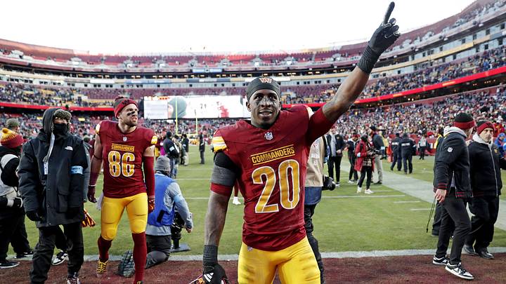 Dec 22, 2024; Landover, Maryland, USA; Washington Commanders safety Quan Martin (20) celebrates after the Washington Commanders beat the Philadelphia Eagles at Northwest Stadium. Mandatory Credit: Peter Casey-Imagn Images