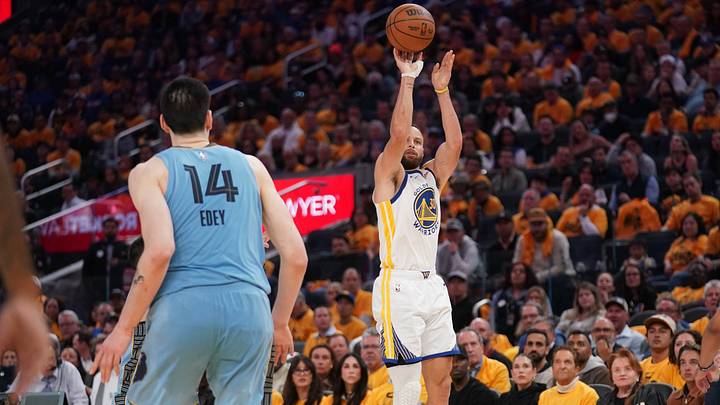 Apr 15, 2025; San Francisco, California, USA; Golden State Warriors guard Stephen Curry (30) makes a three point basket against the Memphis Grizzlies in the fourth quarter at the Chase Center. Mandatory Credit: Cary Edmondson-Imagn Images
