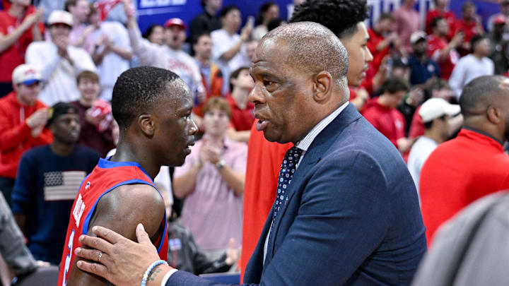 Jan 3, 2026; Dallas, Texas, USA; SMU Mustangs guard Boopie Miller (2) shakes hands with North Carolina Tar Heels head coach Hubert Davis after the Mustangs defeat the North Carolina Tar Heels at Moody Coliseum. Mandatory Credit: Jerome Miron-Imagn Images