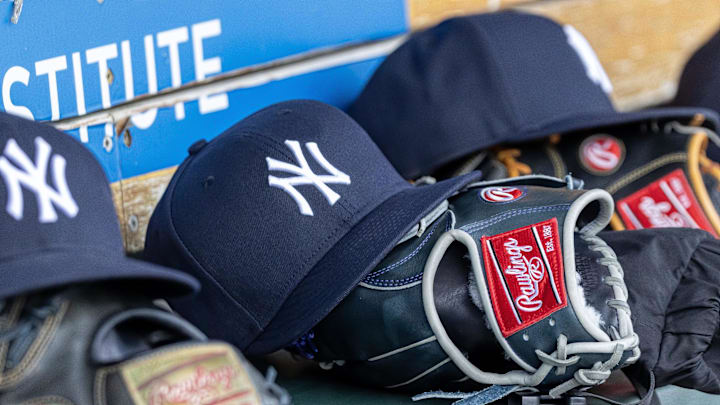 Apr 7, 2025; Detroit, Michigan, USA; New York Yankees baseball hats and gloves in the dugout out in the eighth inning against the Detroit Tigers at Comerica Park. Mandatory Credit: David Reginek-Imagn Images
