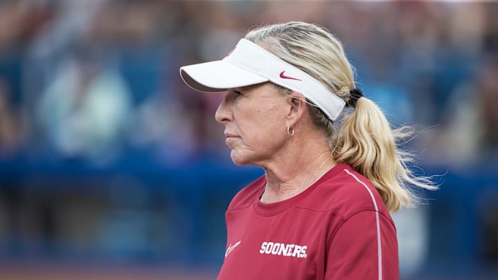 Jun 2, 2025; Oklahoma City, OK, USA; Oklahoma Sooners head coach Patty Gasso looks on in the fifth inning against the Texas Tech Red Raiders during the NCAA Softball Women's College World Series semifinal game at Devon Park. Mandatory Credit: Brett Rojo-Imagn Images Jun 2, 2025; Oklahoma City, OK, USA; Oklahoma Sooners head coach Patty Gasso looks on in the fifth inning against the Texas Tech Red Raiders during the NCAA Softball Women's College World Series semifinal game at Devon Park. Mandatory Credit: Brett Rojo-Imagn Images