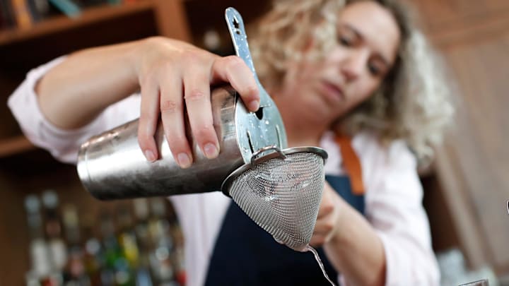 Bartender Erica Cekada pours an Excitable Boy cocktail at the newly opened Nighthawks Lounge on