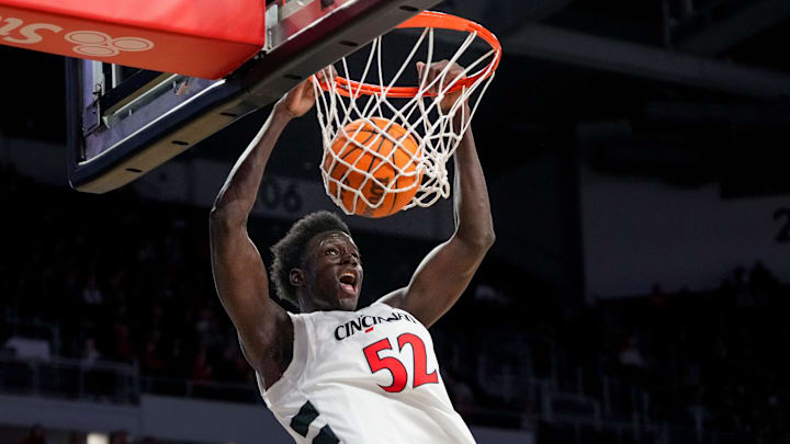 Cincinnati Bearcats center Moustapha Thiam (52) dunks in the first half of the NCAA men’s basketball game between the Cincinnati Bearcats and the NJIT Highlanders at Fifth Third Arena in Cincinnati on Monday, Nov. 24, 2025.