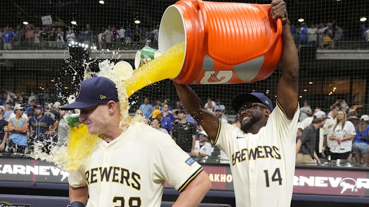 Jul 29, 2025; Milwaukee, Wisconsin, USA; Milwaukee Brewers shortstop Andruw Monasterio (14) dumps Gatorade over Milwaukee Brewers first base Andrew Vaughn (28) head after the game in which Milwaukee Andrew Vaughn (28) hit a grand slam against the Chicago Cubs at American Family Field. Mandatory Credit: Michael McLoone-Imagn Images Jul 29, 2025; Milwaukee, Wisconsin, USA; Milwaukee Brewers shortstop Andruw Monasterio (14) dumps Gatorade over Milwaukee Brewers first base Andrew Vaughn (28) head after the game in which Milwaukee Andrew Vaughn (28) hit a grand slam against the Chicago Cubs at American Family Field. Mandatory Credit: Michael McLoone-Imagn Images