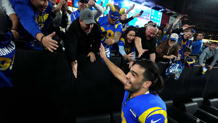 Los Angeles Rams receiver Puka Nacua (17) high-fives fans after their 27-9 playoff win over the Minnesota Vikings at State Farm Stadium on Jan. 13, 2025, in Glendale.