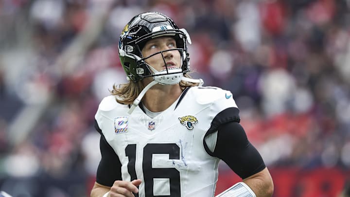 Sep 29, 2024; Houston, Texas, USA; Jacksonville Jaguars quarterback Trevor Lawrence (16) jogs off the field after a play during the fourth quarter against the Houston Texans at NRG Stadium. Mandatory Credit: Troy Taormina-Imagn Images