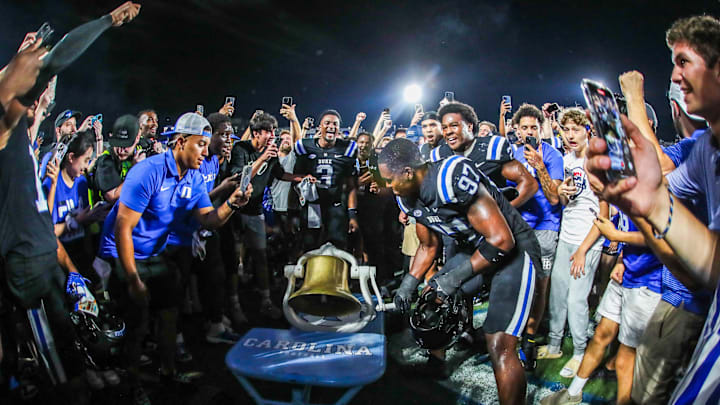 Sep 28, 2024; Durham, North Carolina, USA;   Duke Blue Devils defensive end Wesley Williams (97) rings the North Carolina Tar Heels bell after a win at the end of the second half of the game at Wallace Wade Stadium. 