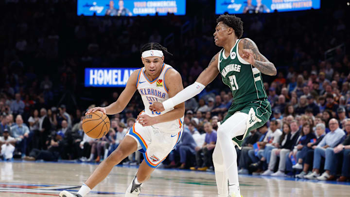 Feb 3, 2025; Oklahoma City, Oklahoma, USA; Oklahoma City Thunder forward Ousmane Dieng (13) drives around Milwaukee Bucks forward Tyler Smith (21) during the second half at Paycom Center. Mandatory Credit: Alonzo Adams-Imagn Images Feb 3, 2025; Oklahoma City, Oklahoma, USA; Oklahoma City Thunder forward Ousmane Dieng (13) drives around Milwaukee Bucks forward Tyler Smith (21) during the second half at Paycom Center. Mandatory Credit: Alonzo Adams-Imagn Images