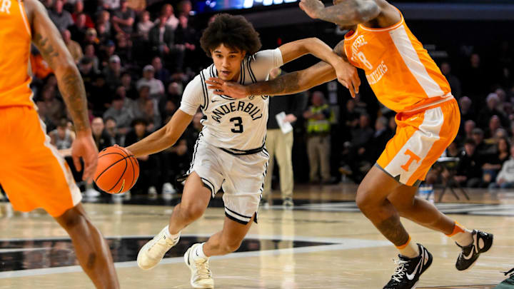Jan 18, 2025; Nashville, Tennessee, USA;  Vanderbilt Commodores guard Tyler Tanner (3) drives past Tennessee Volunteers guard Darlinstone Dubar (8) during the first half at Memorial Gymnasium. Mandatory Credit: Steve Roberts-Imagn Images