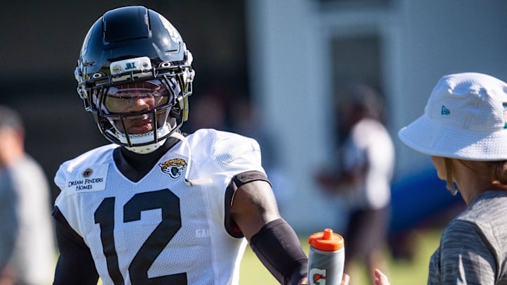 Jacksonville Jaguars wide receiver Travis Hunter (12) grabs water while running drills during an NFL training camp seventh session at the Miller Electric Center, Thursday, July 31, 2025, in Jacksonville, Fla. [Doug Engle/Florida Times-Union]