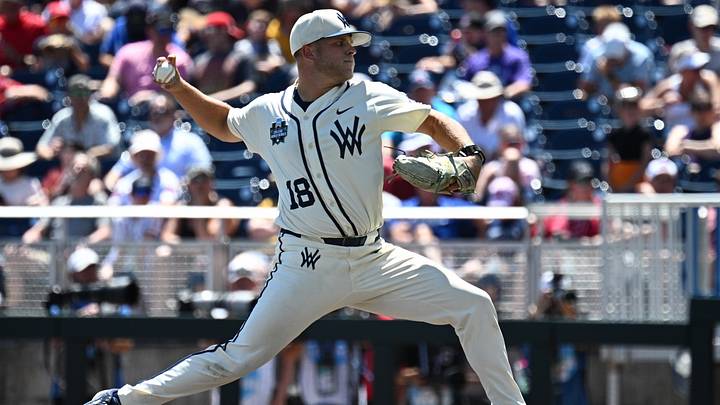Jun 12, 2026; Omaha, NE, USA;  West Virginia Mountaineers pitcher Ian Korn (18) throws against the Troy Trojans during the fourth inning at Charles Schwab Field. Mandatory Credit: Steven Branscombe-Imagn Images