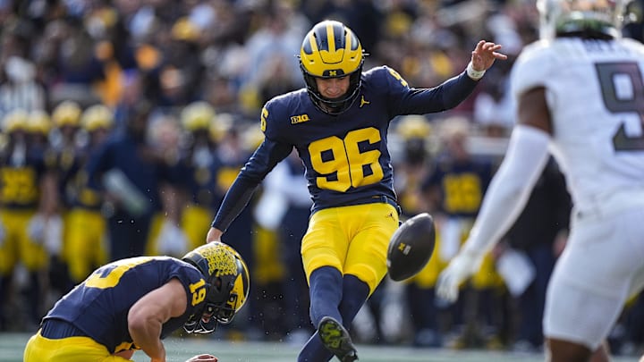 Michigan place kicker Dominic Zvada (96) attempts an extra point against Oregon during the first half at Michigan Stadium in Ann Arbor on Saturday, Nov. 2, 2024.