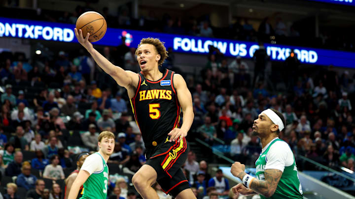 Mar 18, 2026; Dallas, Texas, USA; Atlanta Hawks guard Dyson Daniels (5) shoots past Dallas Mavericks forward P.J. Washington (25) during the second half at American Airlines Center. Mandatory Credit: Kevin Jairaj-Imagn Images