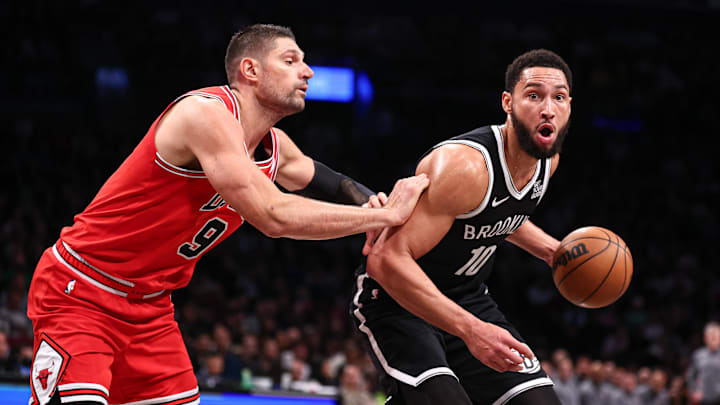 Brooklyn Nets guard Ben Simmons (10) is defended by Chicago Bulls center Nikola Vucevic (9) during the second half at Barclays Center. Mandatory Credit: Vincent Carchietta-Imagn Images