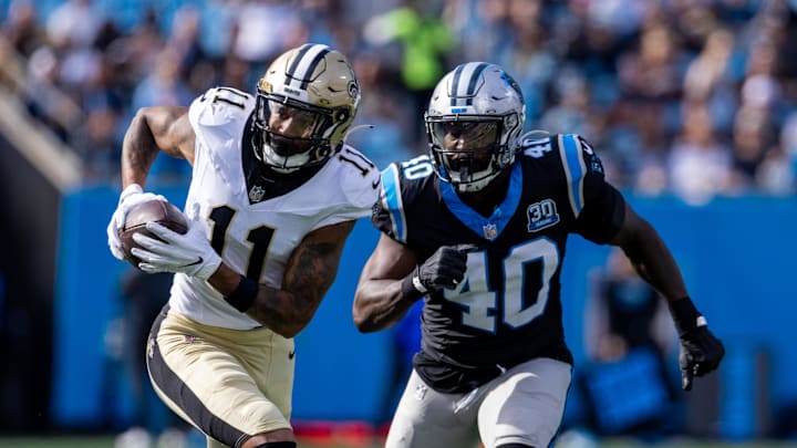 New Orleans Saints wide receiver Cedrick Wilson Jr. (11) runs away from Carolina Panthers linebacker Charles Harris (40).