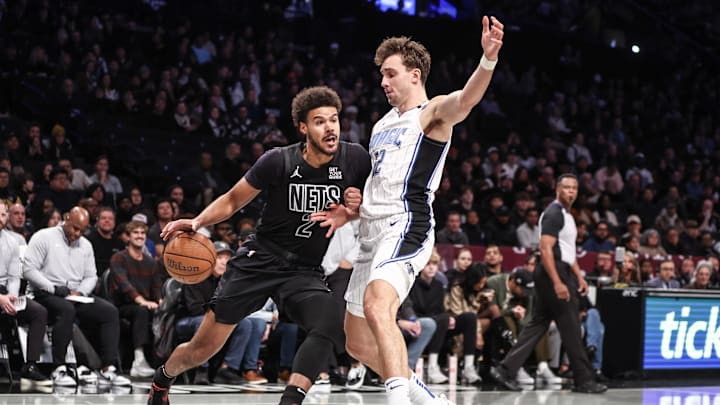 Nov 29, 2024; Brooklyn, New York, USA; Brooklyn Nets forward Cameron Johnson (2) looks to drive past Orlando Magic forward Franz Wagner (22) in the first quarter at Barclays Center. Mandatory Credit: Wendell Cruz-Imagn Images Nov 29, 2024; Brooklyn, New York, USA; Brooklyn Nets forward Cameron Johnson (2) looks to drive past Orlando Magic forward Franz Wagner (22) in the first quarter at Barclays Center. Mandatory Credit: Wendell Cruz-Imagn Images