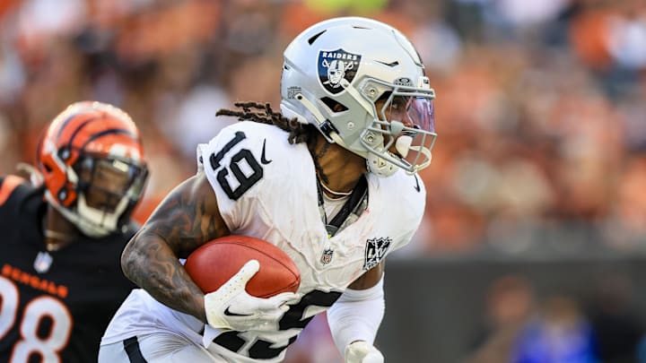 Nov 3, 2024; Cincinnati, Ohio, USA; Las Vegas Raiders wide receiver DJ Turner (19) runs with the ball against the Cincinnati Bengals in the second half at Paycor Stadium. Mandatory Credit: Katie Stratman-Imagn Images