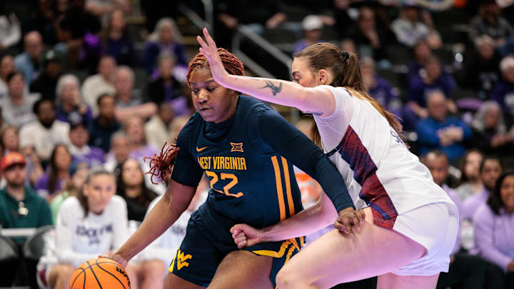 Mar 8, 2026; Kansas City, MO, USA; West Virginia Mountaineers forward Kierra Wheeler (22) drives to the basket during the first half against the TCU Horned Frogs at T-Mobile Center. Mandatory Credit: William Purnell-Imagn Images