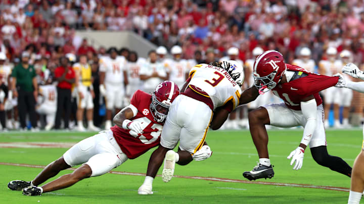 Sep 6, 2025; Tuscaloosa, Alabama, USA; Louisiana Monroe Warhawks running back Braylon McReynolds (3) is brought down by Alabama Crimson Tide's (43) and defensive lineman Jordan Renaud (11) during the first quarter at Saban Field at Bryant-Denny Stadium. 