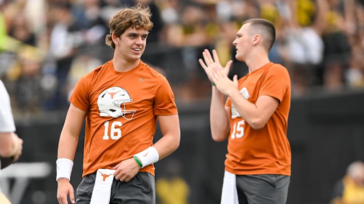 Nashville, Tennessee, USA;  Texas Longhorns quarterback Arch Manning (16) and quarterback Trey Owens (15) talk against the Vanderbilt Commodores during pregame warmups at FirstBank Stadium. 