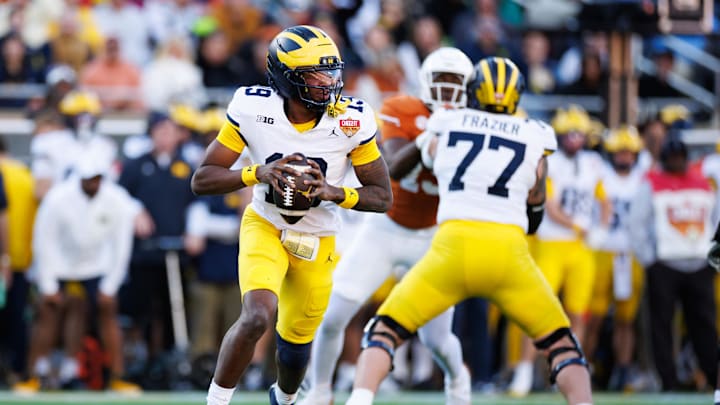 Dec 31, 2025; Orlando, FL, USA; Michigan Wolverines quarterback Bryce Underwood (19) looks to throw against the Texas Longhorns during the first half at Camping World Stadium. Mandatory Credit: Matt Pendleton-Imagn Images