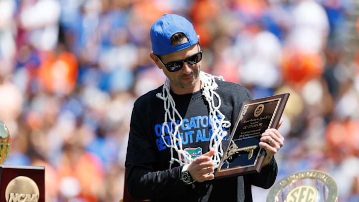Apr 12, 2025; Gainesville, FL, USA; Florida Gators head coach Todd Golden holds the City of Gainesville Key to the City during the National Championship celebration at Ben Hill Griffin Stadium. Mandatory Credit: Matt Pendleton-Imagn Images