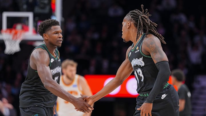 Feb 9, 2026; Minneapolis, Minnesota, USA; Minnesota Timberwolves guard Anthony Edwards (5) and guard Ayo Dosunmu (13) celebrate against the Atlanta Hawks in the second quarter at Target Center. Mandatory Credit: Brad Rempel-Imagn Images
