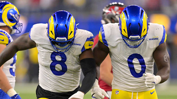 Nov 23, 2025; Inglewood, California, USA; Los Angeles Rams linebacker Jared Verse (8) and linebacker Byron Young (0) celebrate after a sack of Tampa Bay Buccaneers quarterback Teddy Bridgewater (10) in the second half at SoFi Stadium. Mandatory Credit: Jayne Kamin-Oncea-Imagn Images