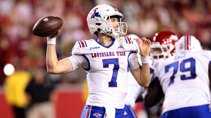 Nov 23, 2024; Fayetteville, Arkansas, USA; Louisiana Tech Bulldogs quarterback Evan Bullock (7) passes during the fourth quarter against the Arkansas Razorbacks at Donald W. Reynolds Razorback Stadium. Arkansas won 35-14. Mandatory Credit: Nelson Chenault-Imagn Images